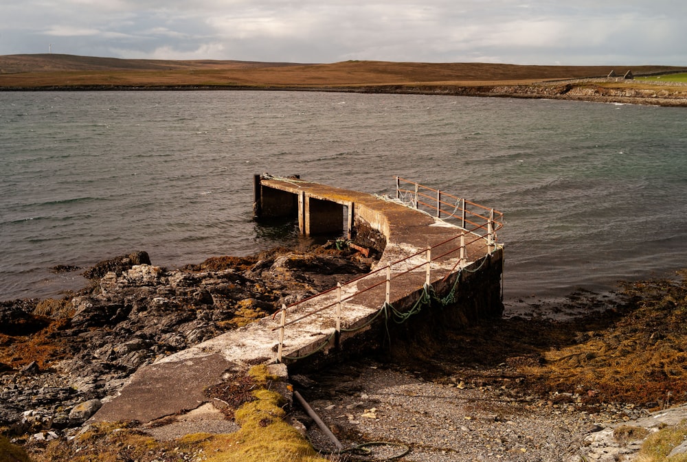 a dock on the edge of a body of water