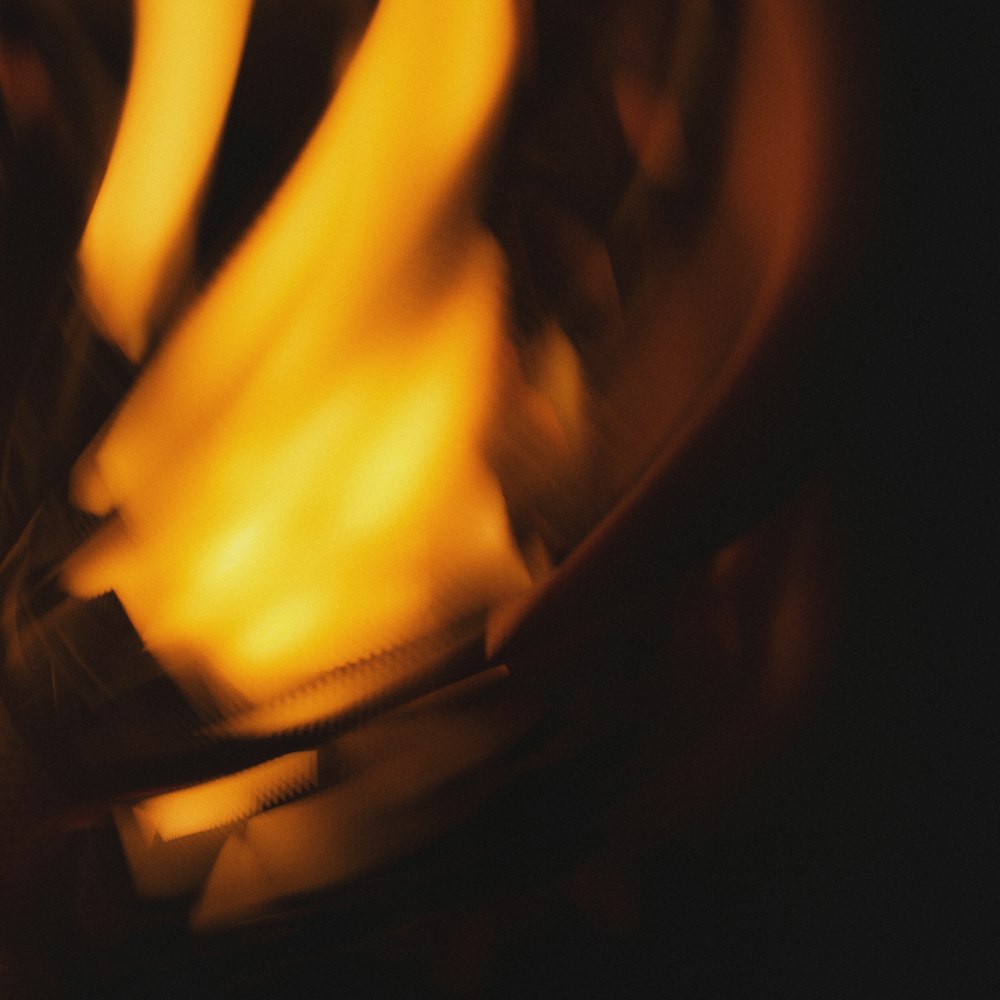 a close up of a fire with a blurry background
