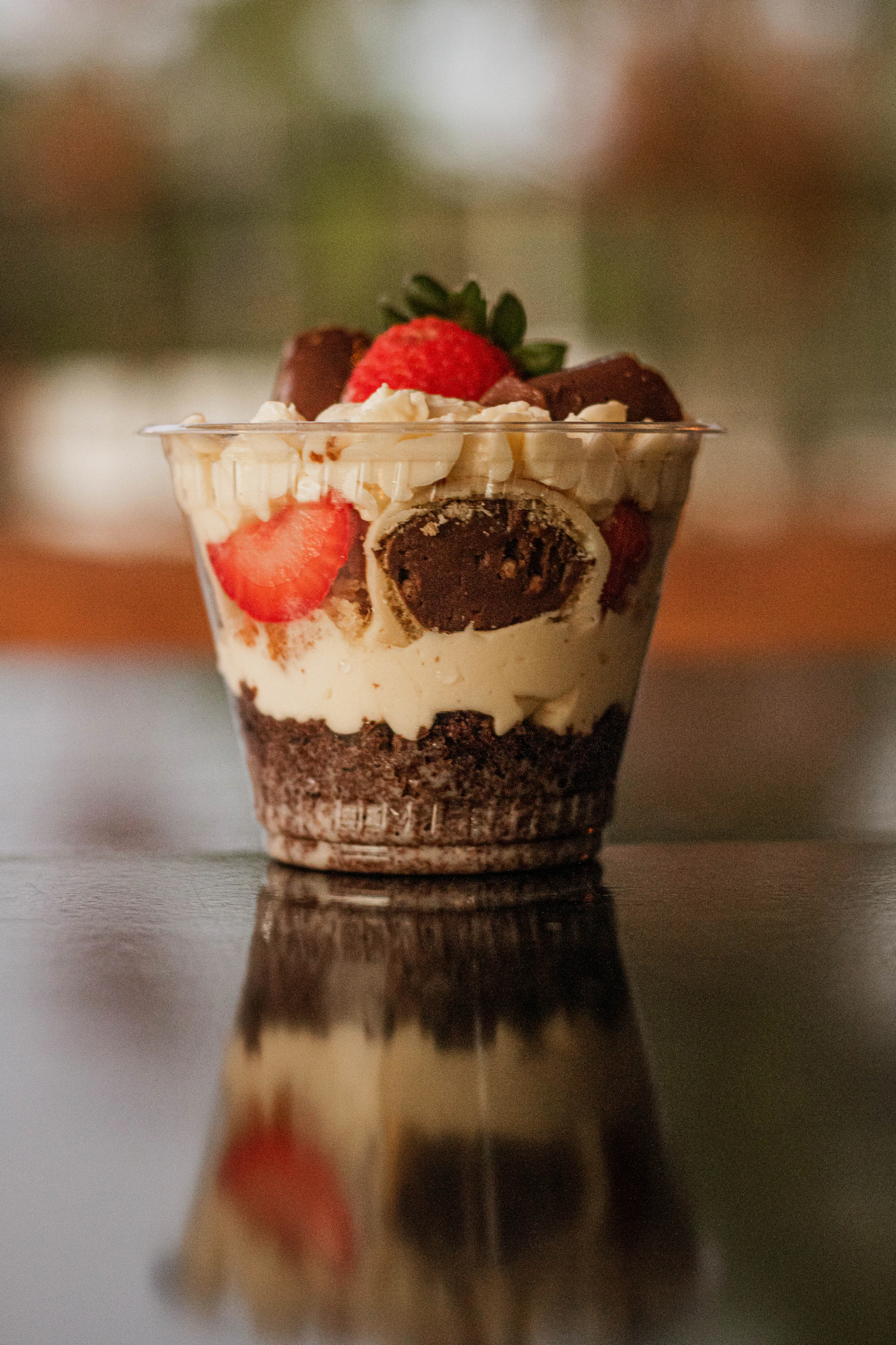 a dessert with strawberries and chocolate on a table