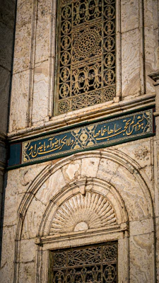 a close up of a building with a metal door