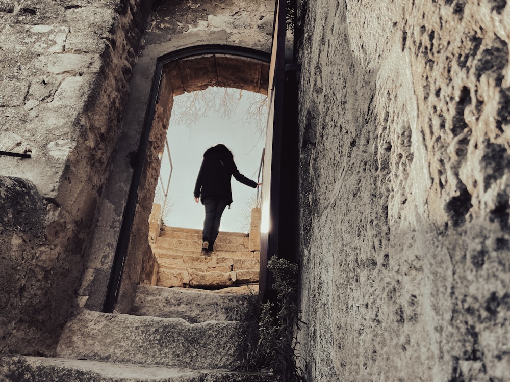 a person walking up a set of stairs