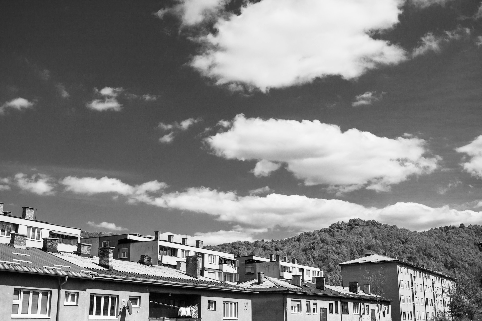 woman wearing yellow long-sleeved dress under white clouds and blue sky during daytime