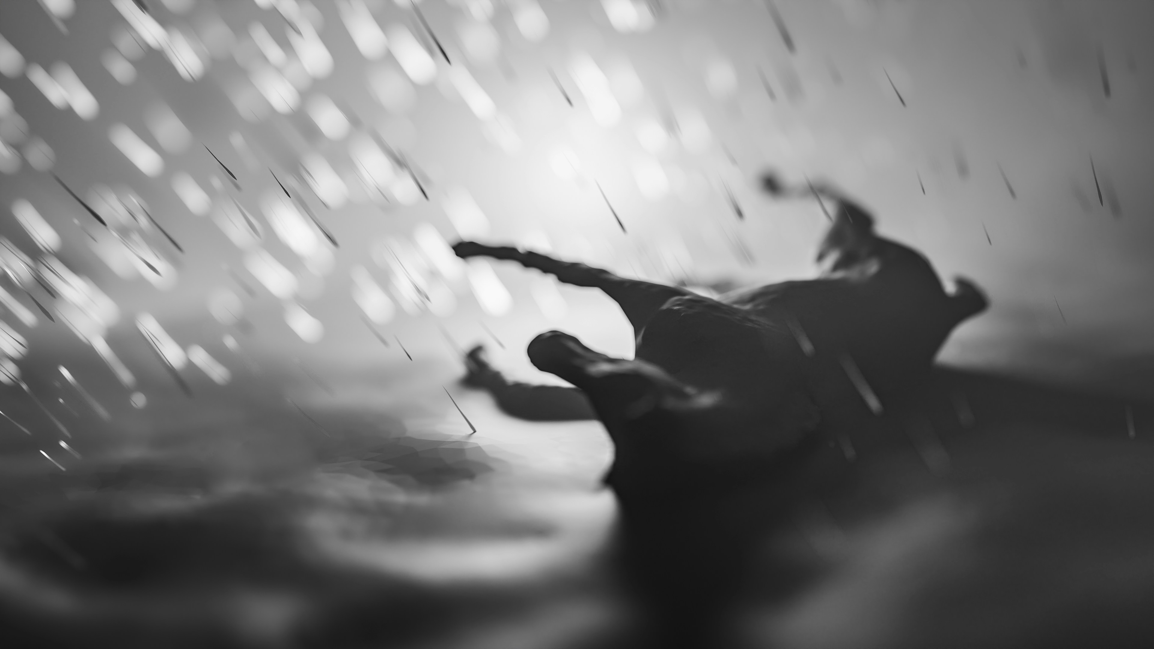 a black and white photo of a person in the rain