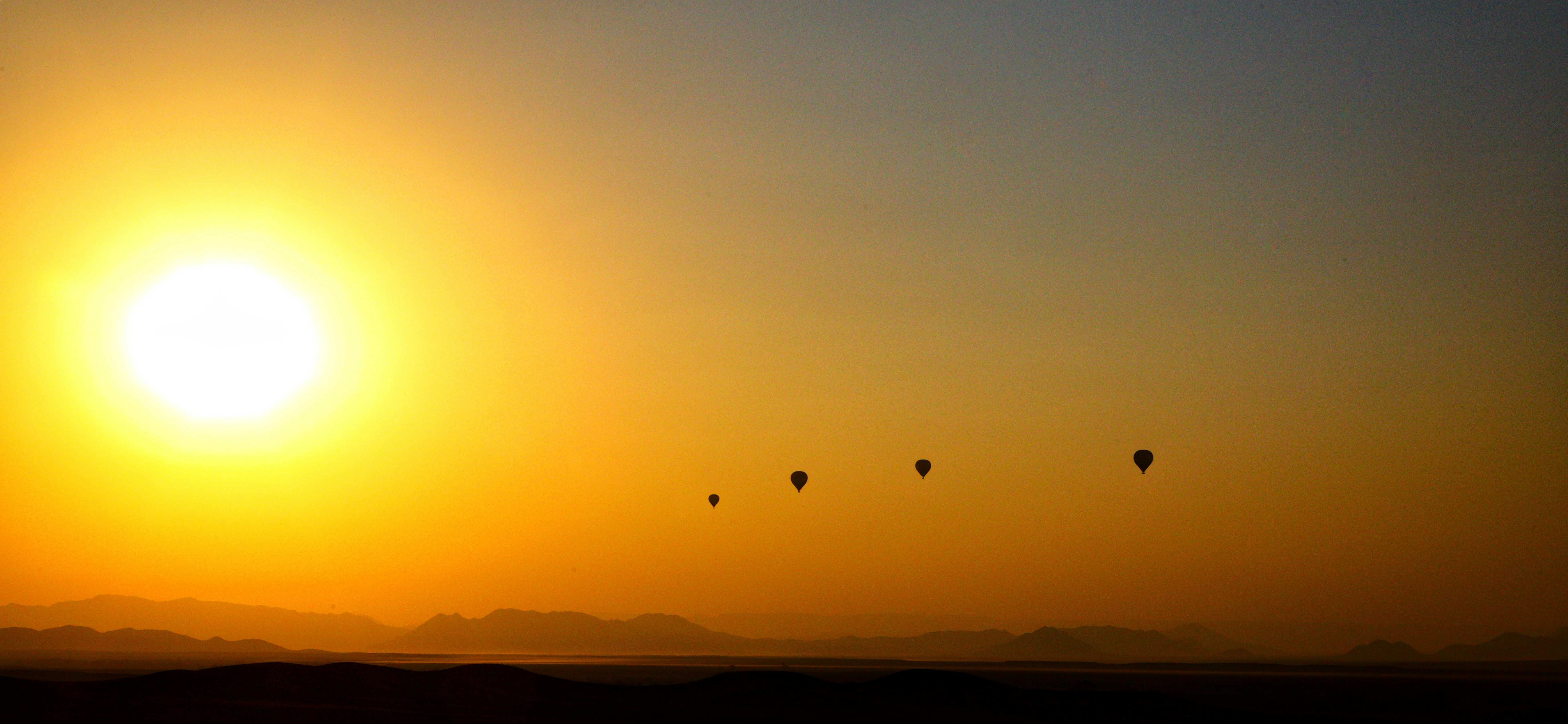 Hot air balloons at sunrise above Sossusvlei 