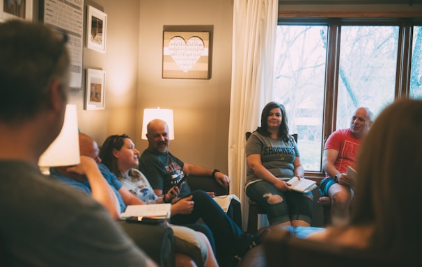 a group of people sitting in a living room