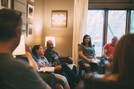 a group of people sitting in a living room