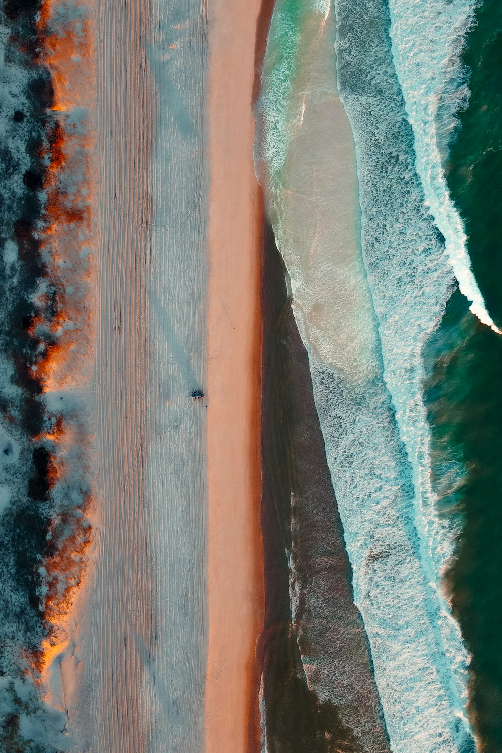 an aerial view of a beach and ocean