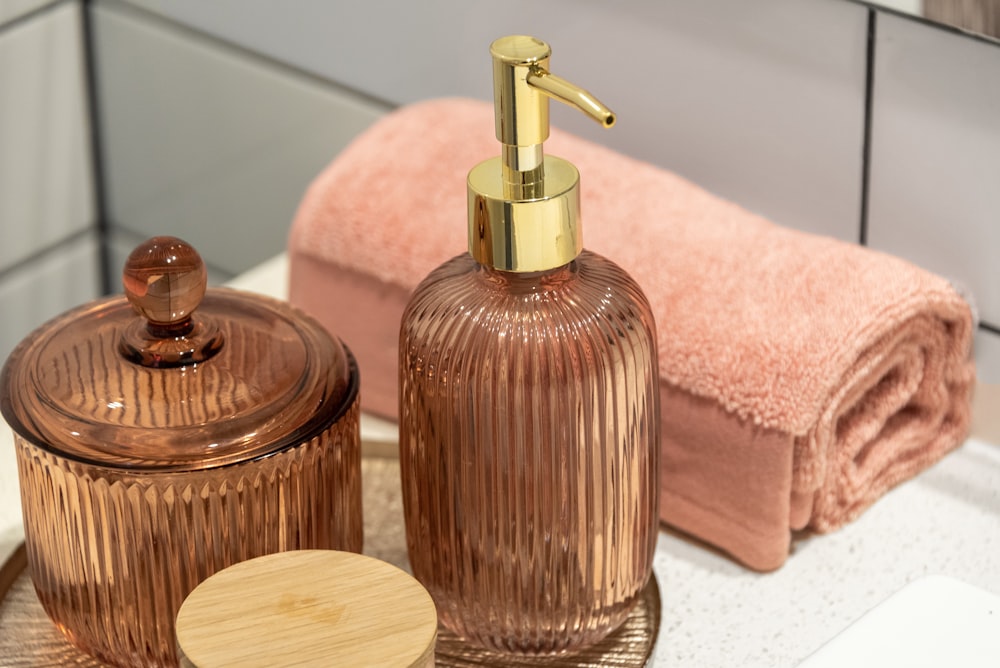 a bathroom sink with a soap dispenser and a soap dish