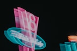 a neon sign is shown in the dark