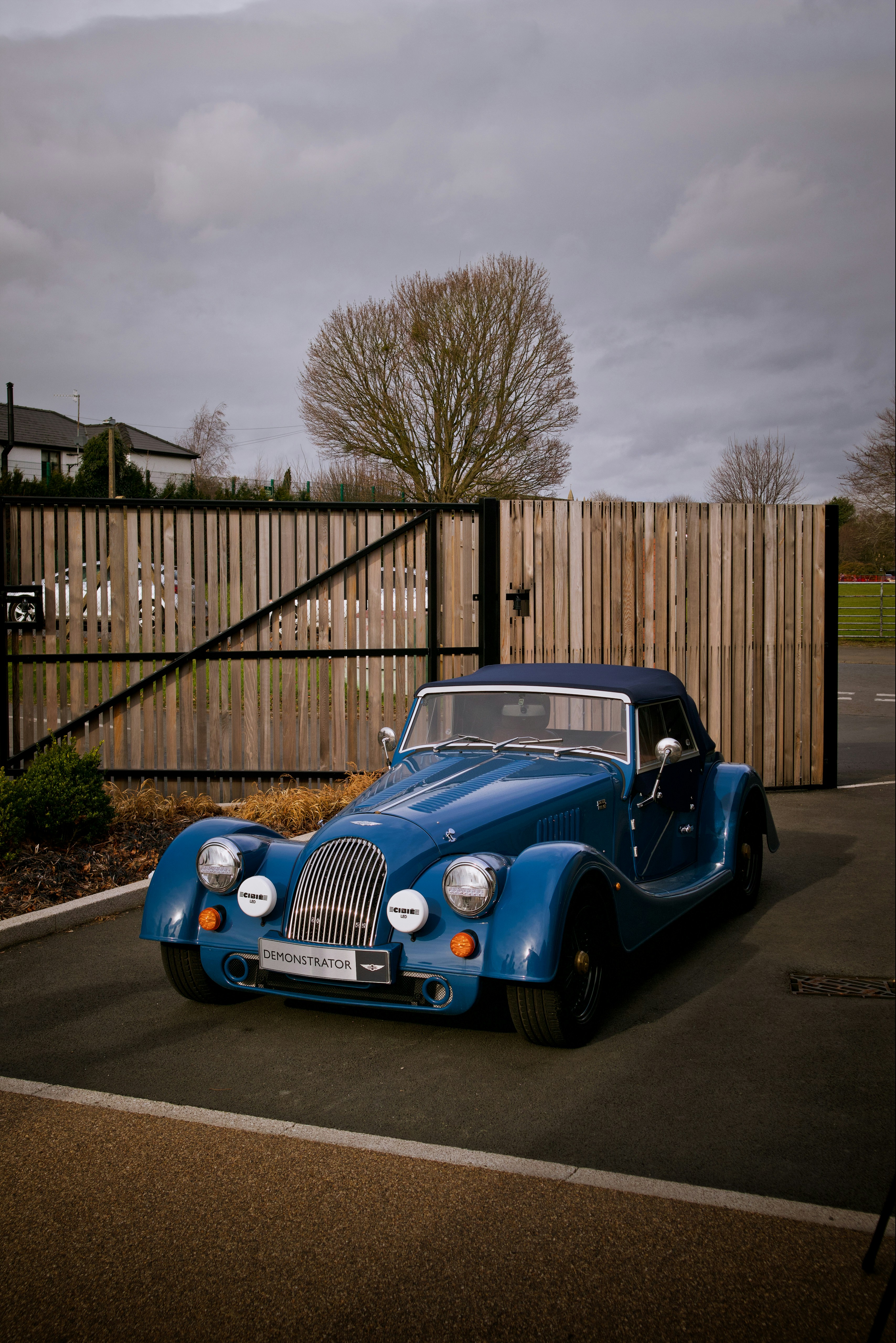 a blue car parked in a parking lot