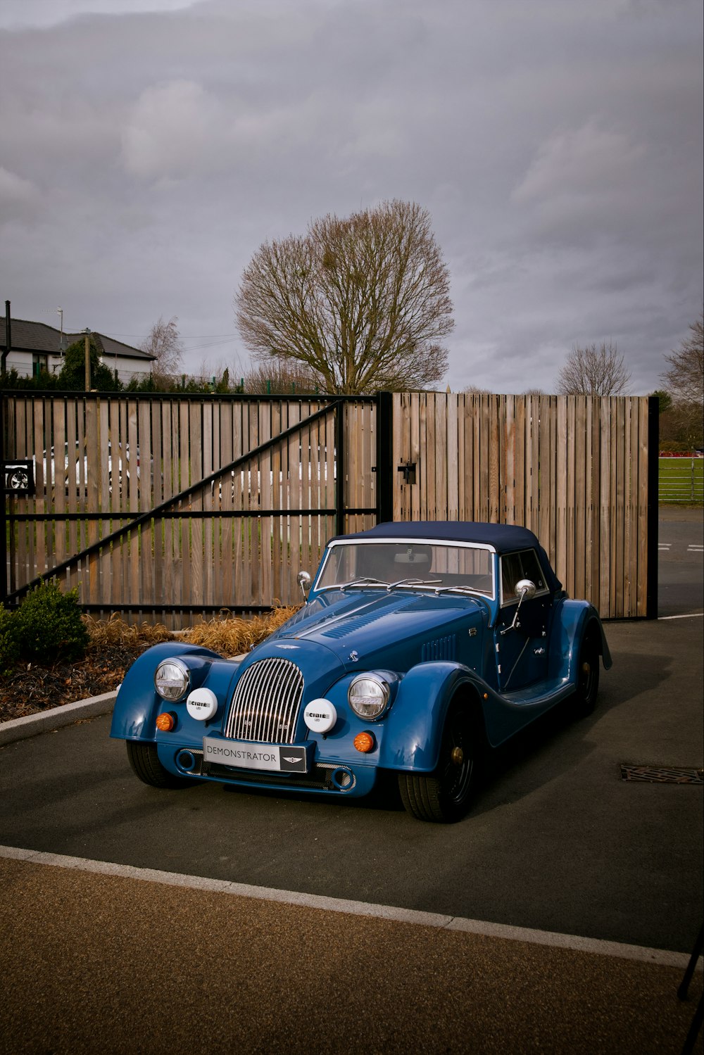 a blue car parked in a parking lot