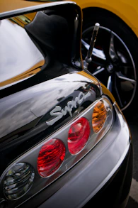 a close up of a sports car's tail lights