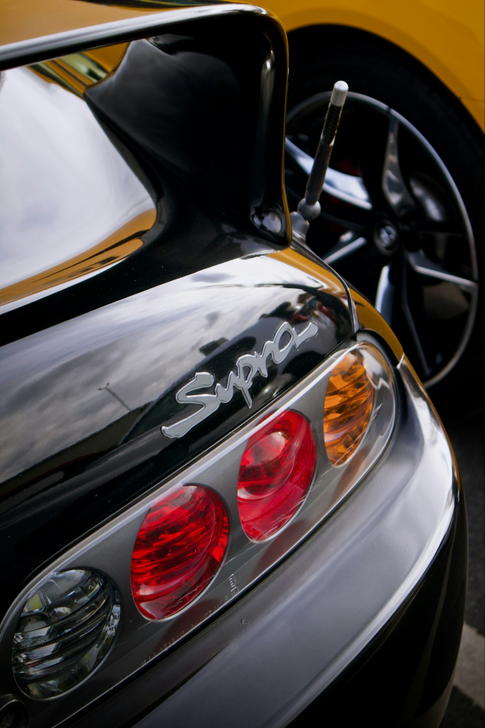 a close up of a sports car's tail lights