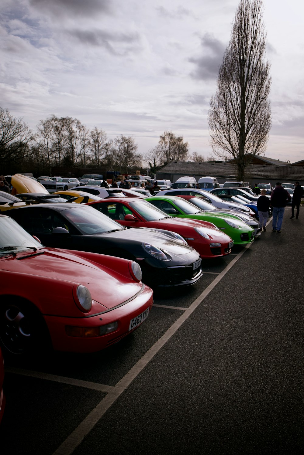 a row of parked cars in a parking lot