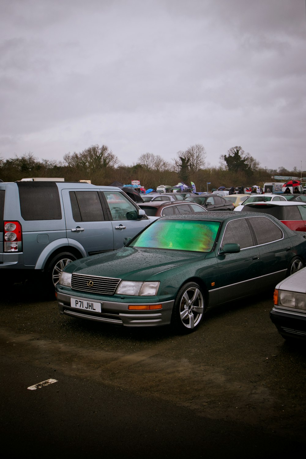 a group of cars parked in a parking lot