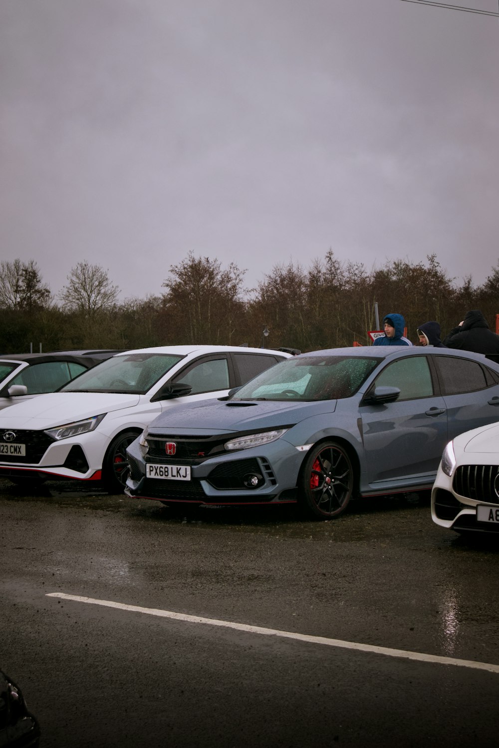 a group of cars parked next to each other in a parking lot