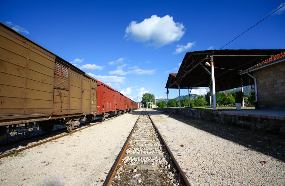 a train yard with several train cars on the tracks