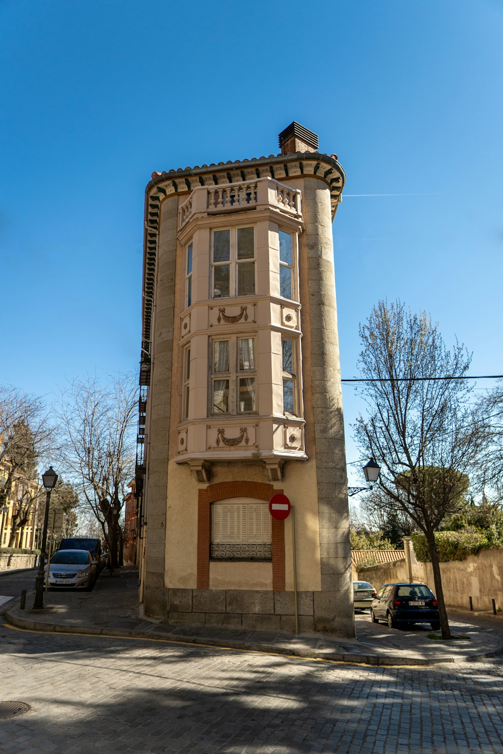 a tall building sitting on the side of a road