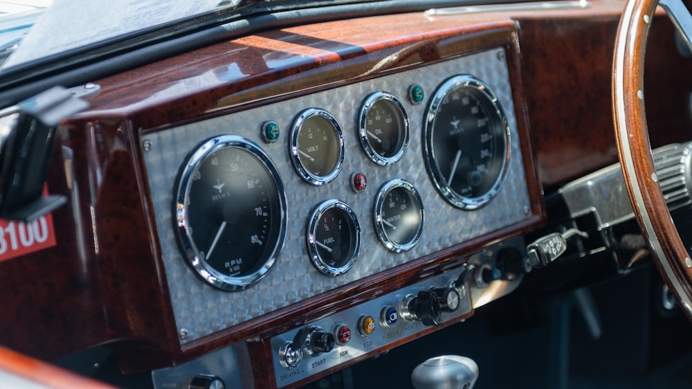 a dashboard of a car with a steering wheel