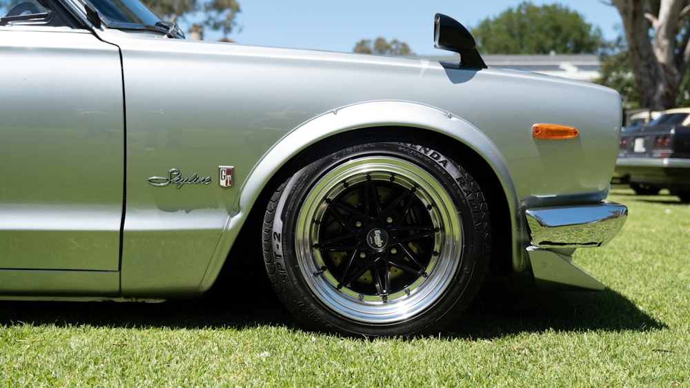 a close up of a car on a grass field