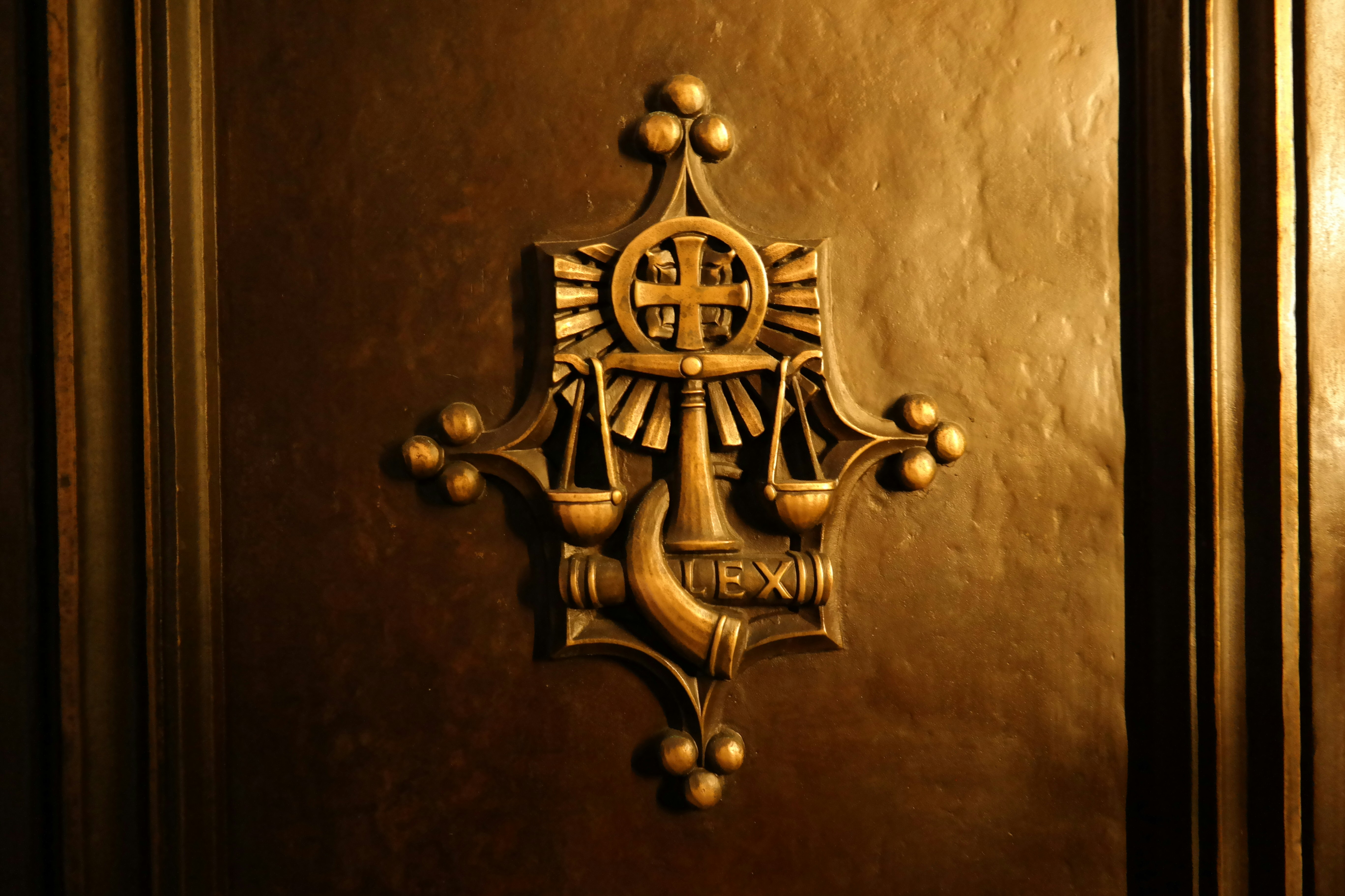 a golden door with a cross on it