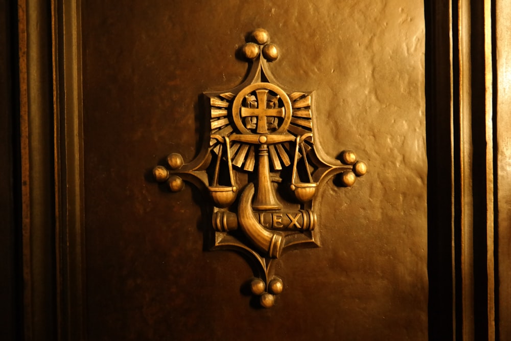 a golden door with a cross on it