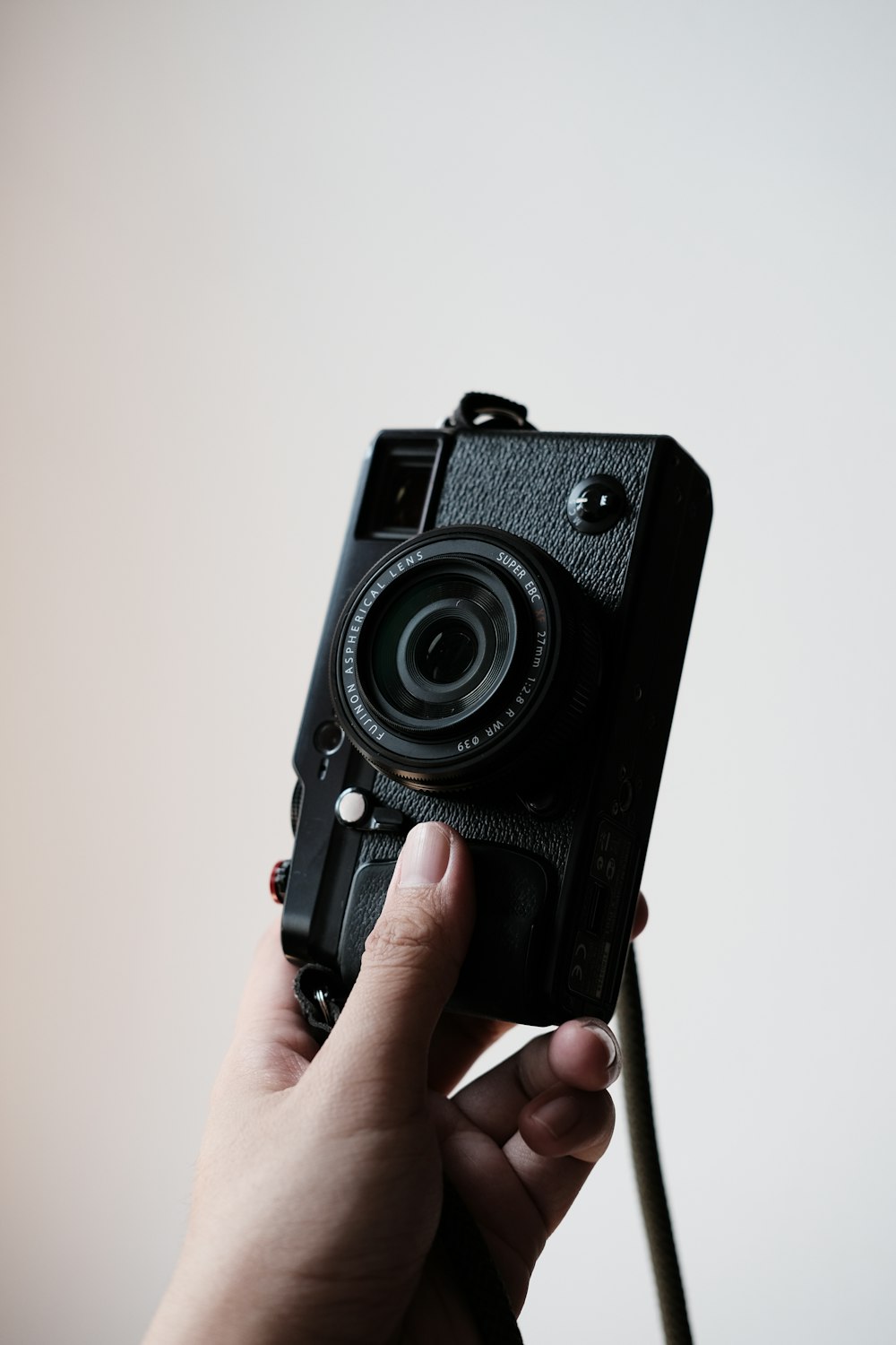 a person holding a camera in their hand