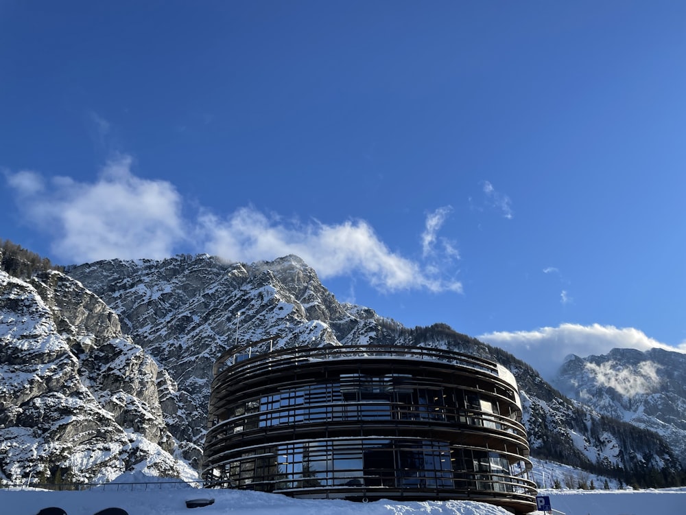 a building in the middle of a snowy mountain