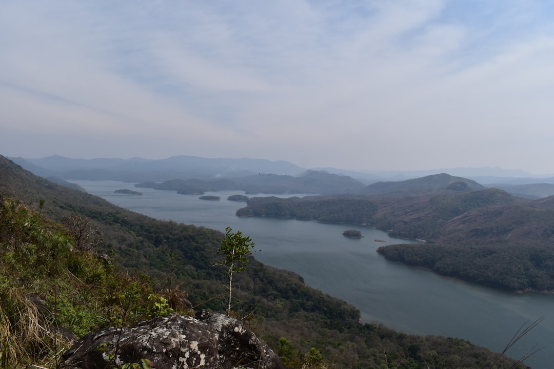 a large body of water surrounded by mountains,