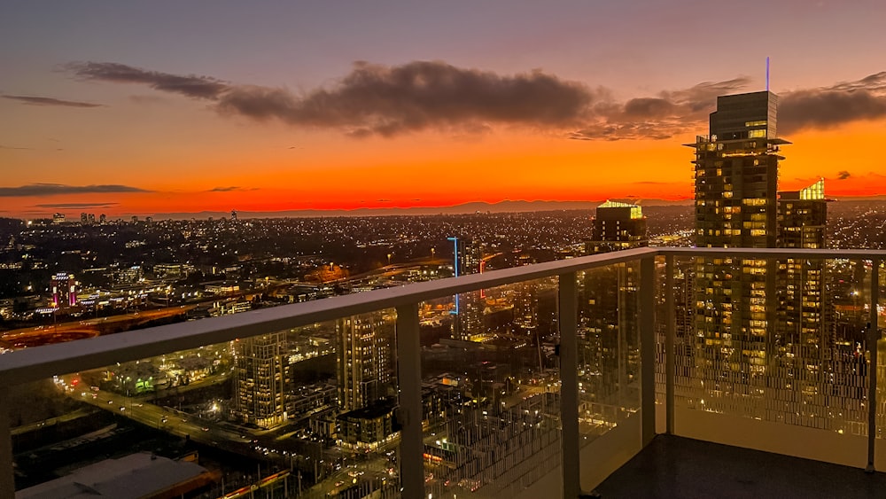 a balcony with a view of a city at night