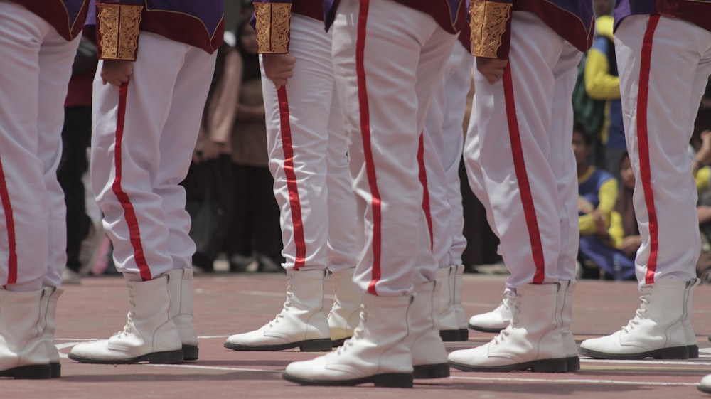 a group of men in white and red uniforms