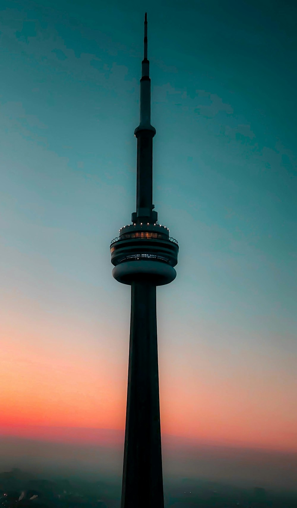 a very tall tower with a sky background