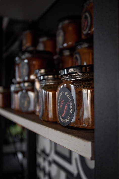 A vibrant selection of artisanal sauces displayed in jars.