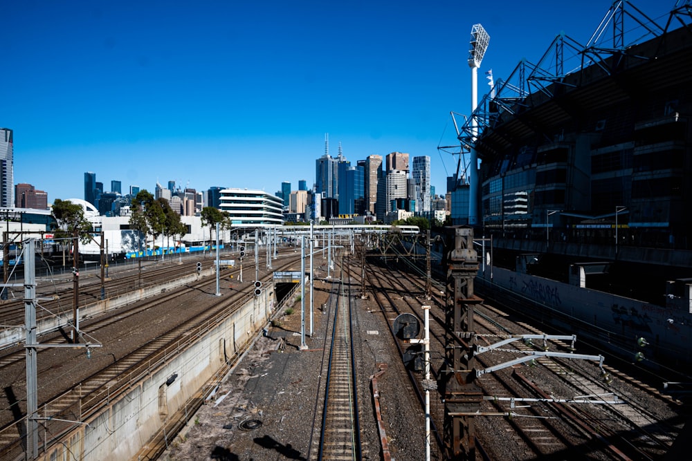 a view of a train track with a city in the background