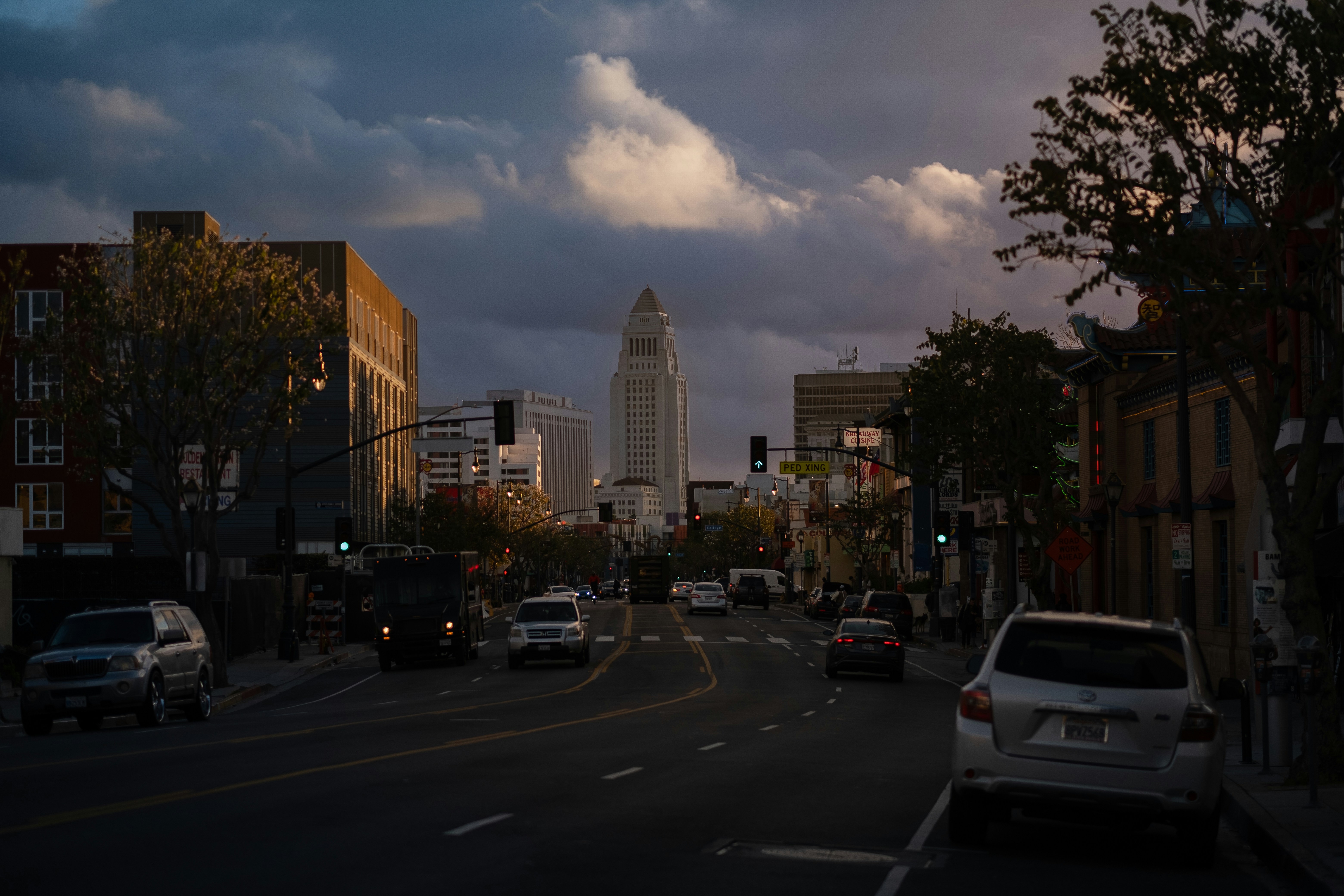 a view of a city street filled with lots of traffic