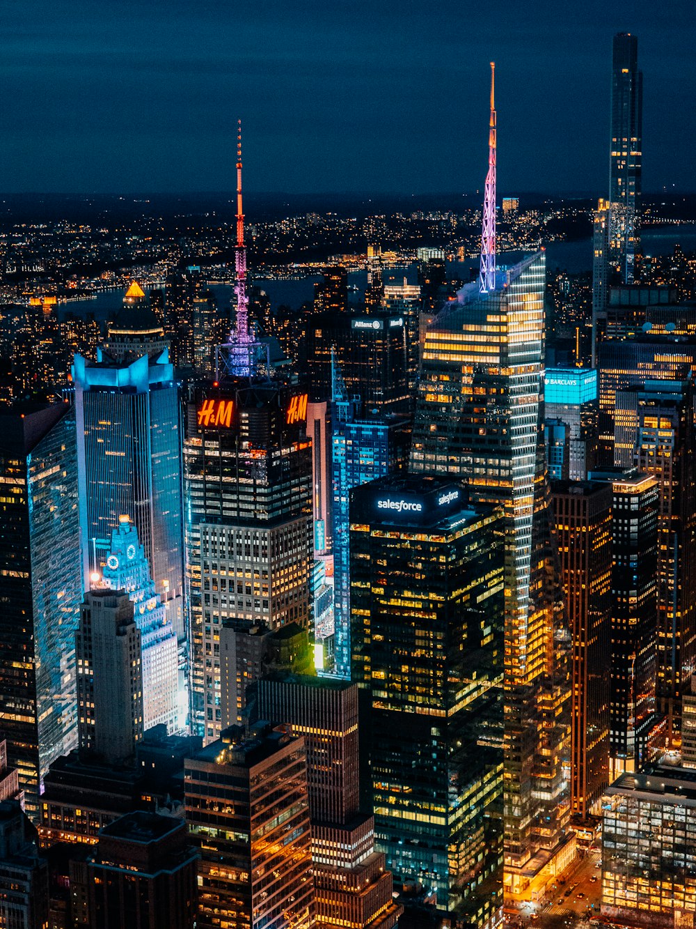 a view of a city at night from the top of a skyscraper