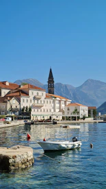 a small boat floating on top of a body of water