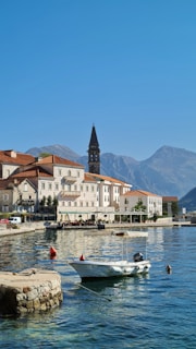 a small boat floating on top of a body of water