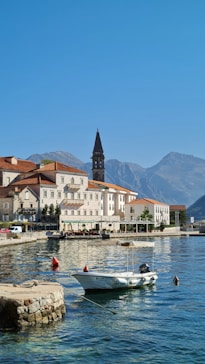 a small boat floating on top of a body of water