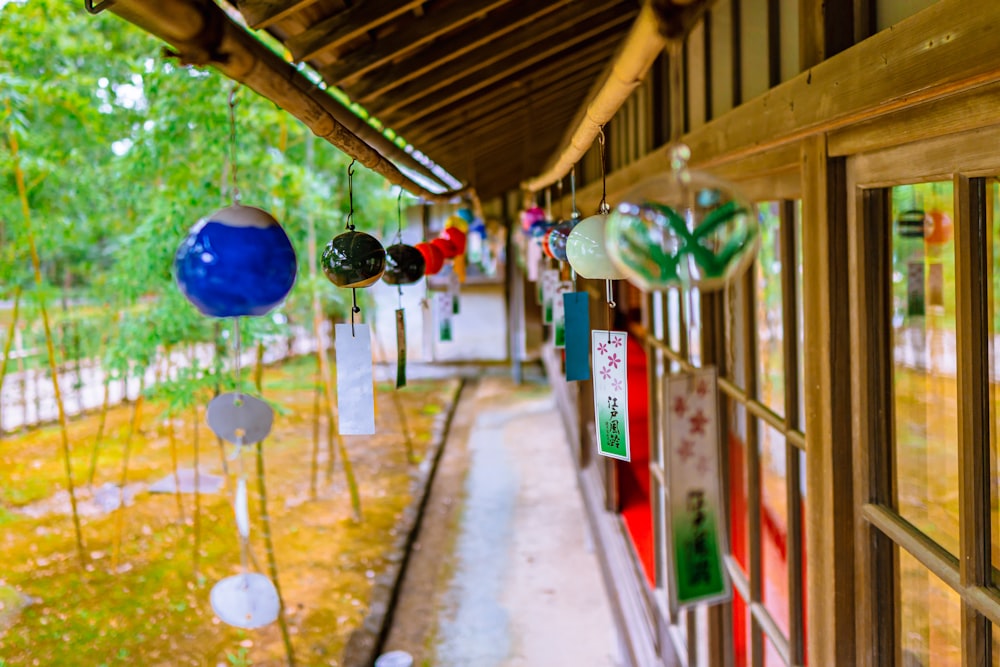 a group of glass ornaments hanging from the side of a building