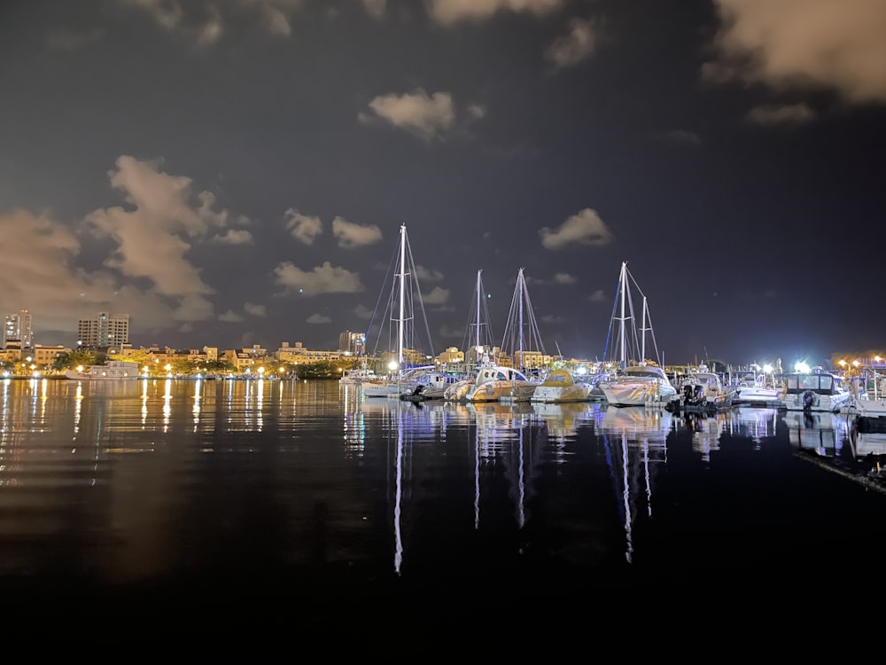 a harbor filled with lots of boats under a cloudy sky