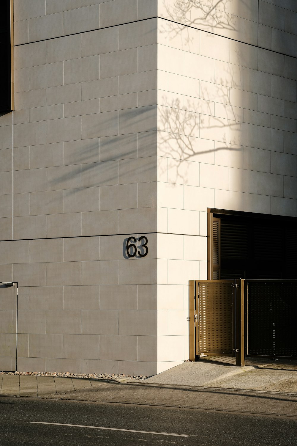 a white building with a number on the side of it