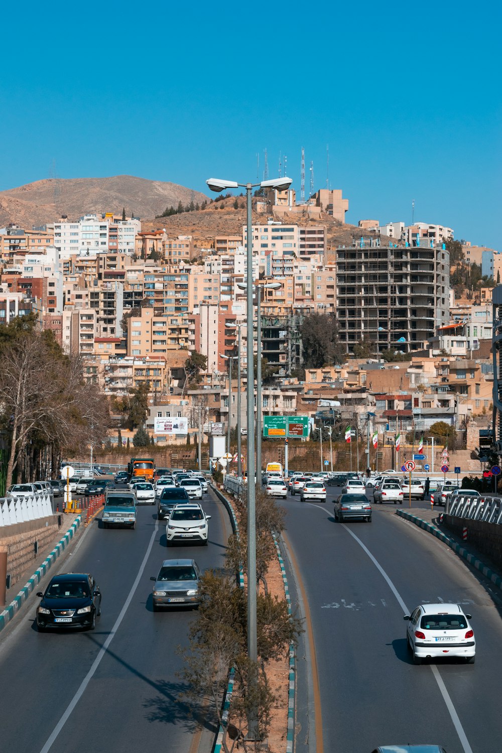 a bunch of cars that are driving down a street