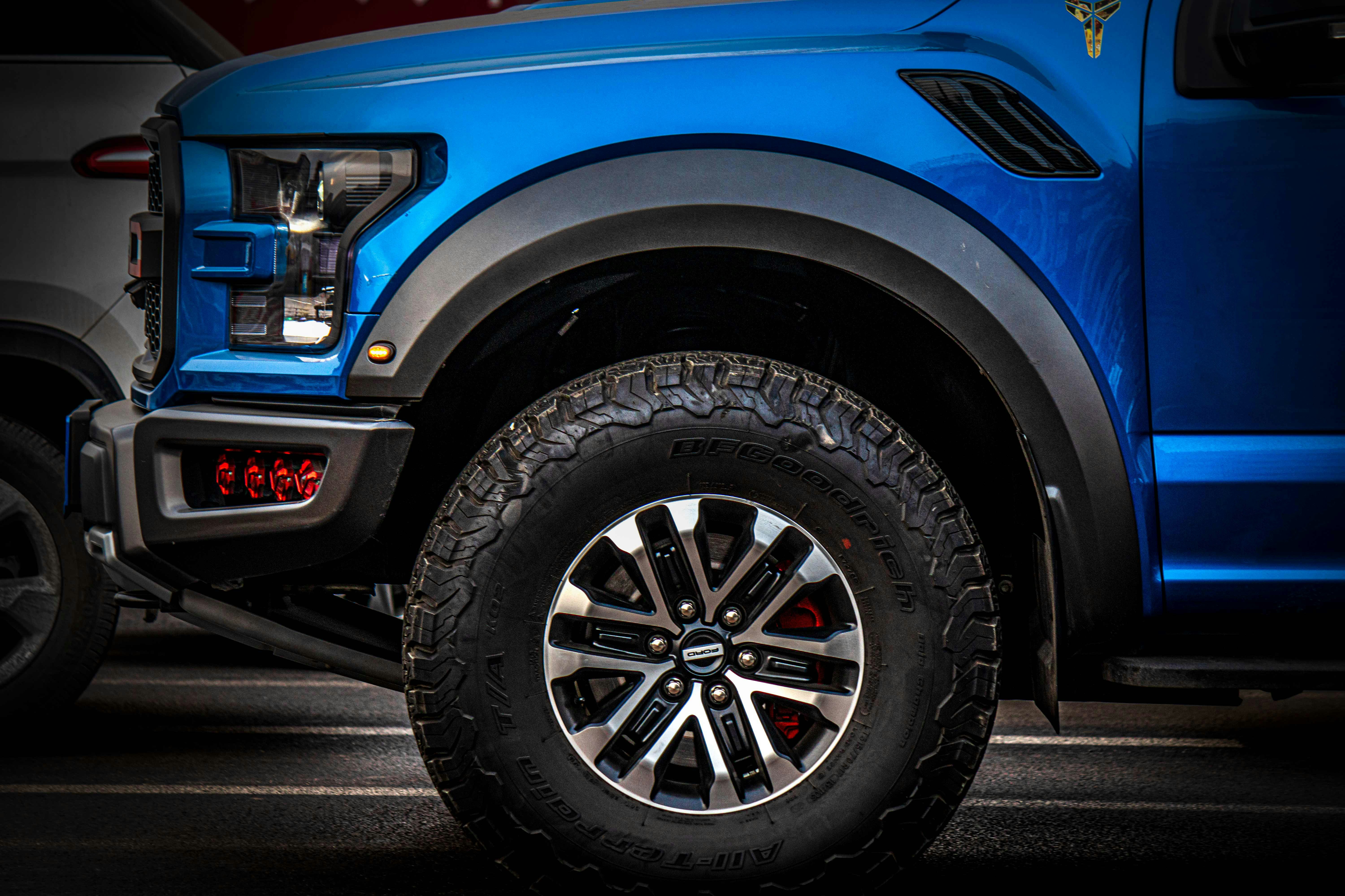 a blue truck parked in a parking lot