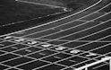 a black and white photo of a running track