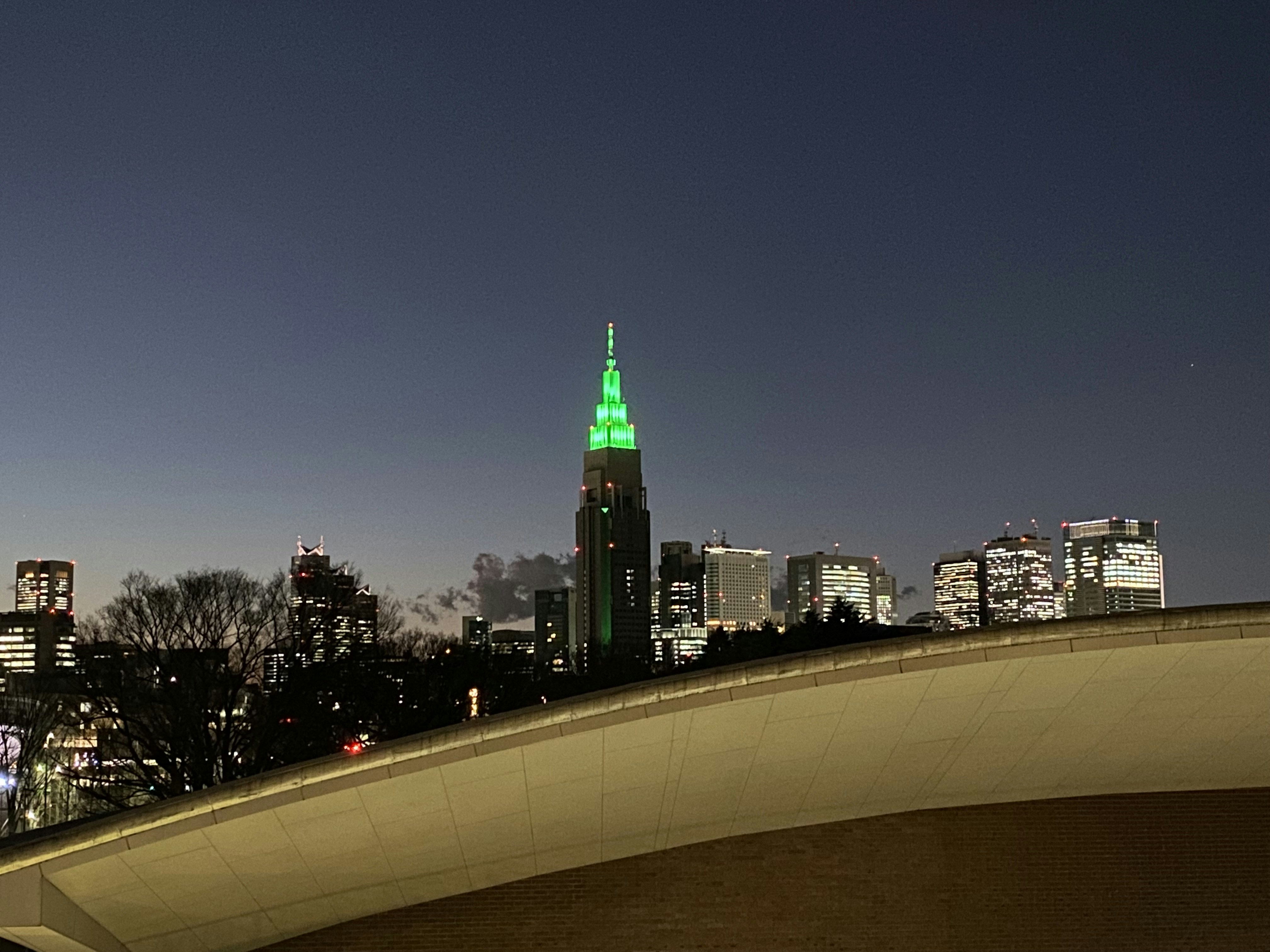 a view of a city at night from a bridge