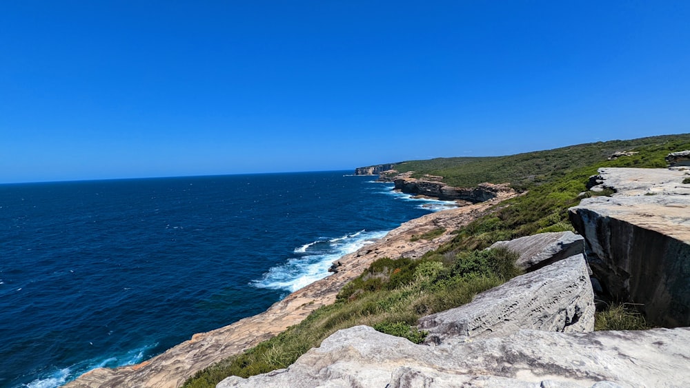 a view of the ocean from the top of a cliff