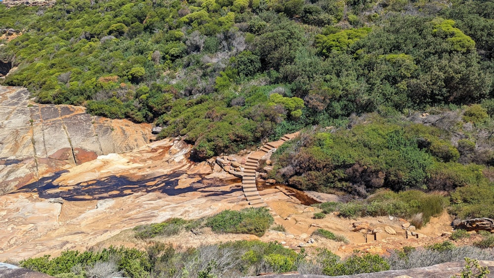 an aerial view of a rocky area with stairs