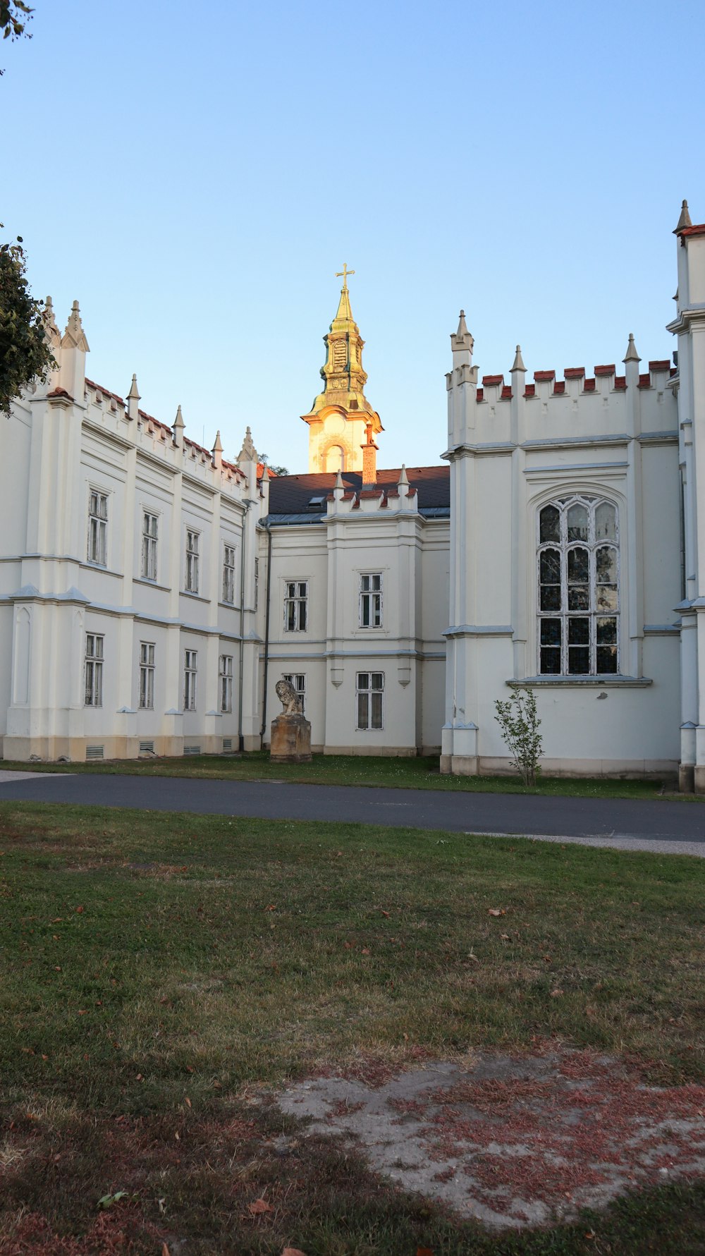 a large white building with a clock tower