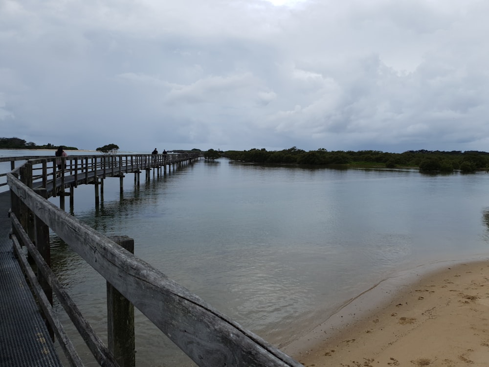 a wooden bridge over a body of water